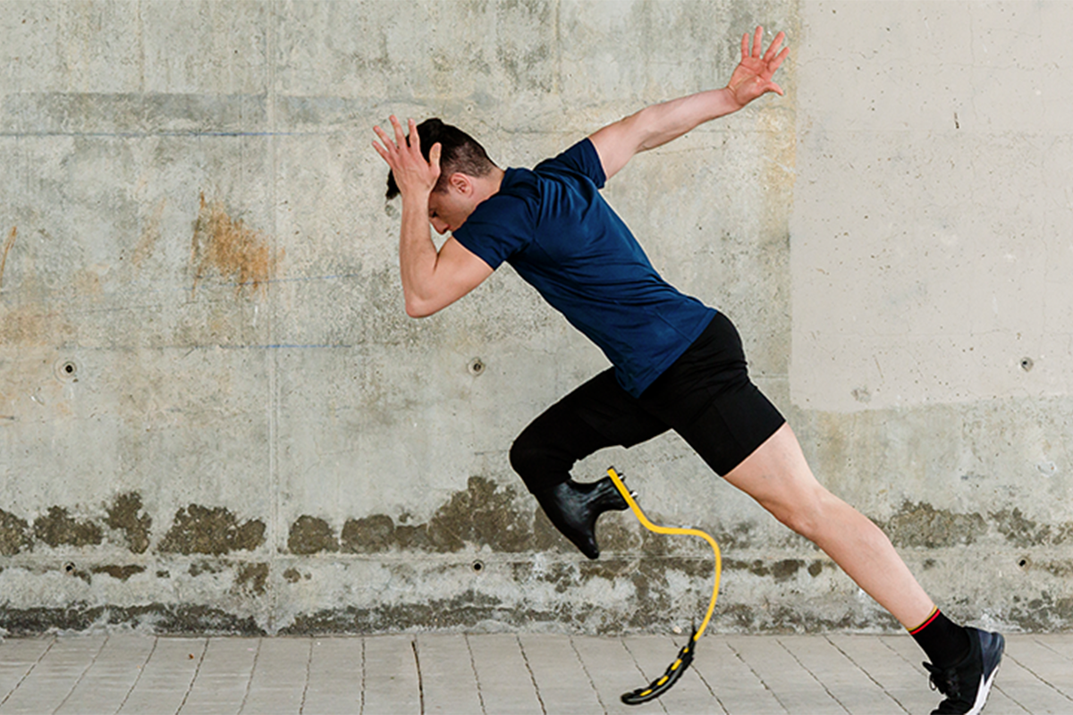 Man with a prosthetic leg running