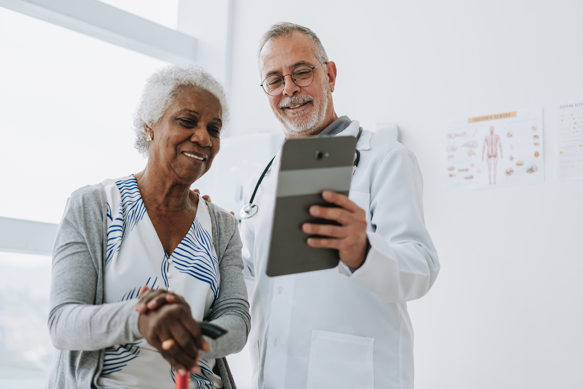 Provider presenting his patient results on a tablet