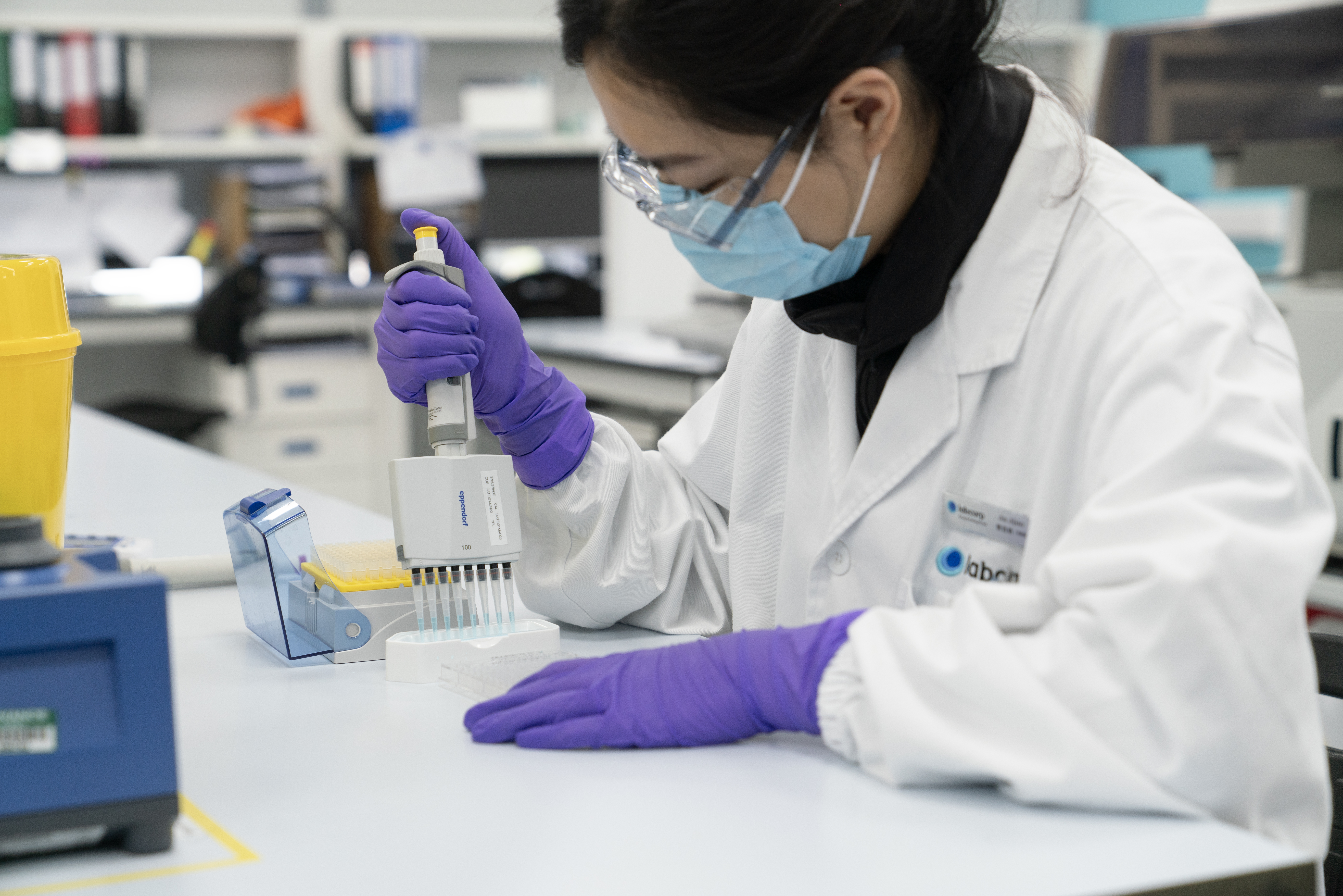 Woman looking at a tablet in a dark room